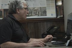 JP Roofing owner works on computer