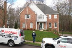 JP Roofing van in front of house