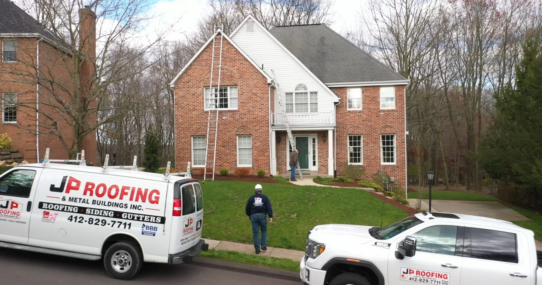 Residential Roofers Near You - JP Roofing replacing roof on residential home